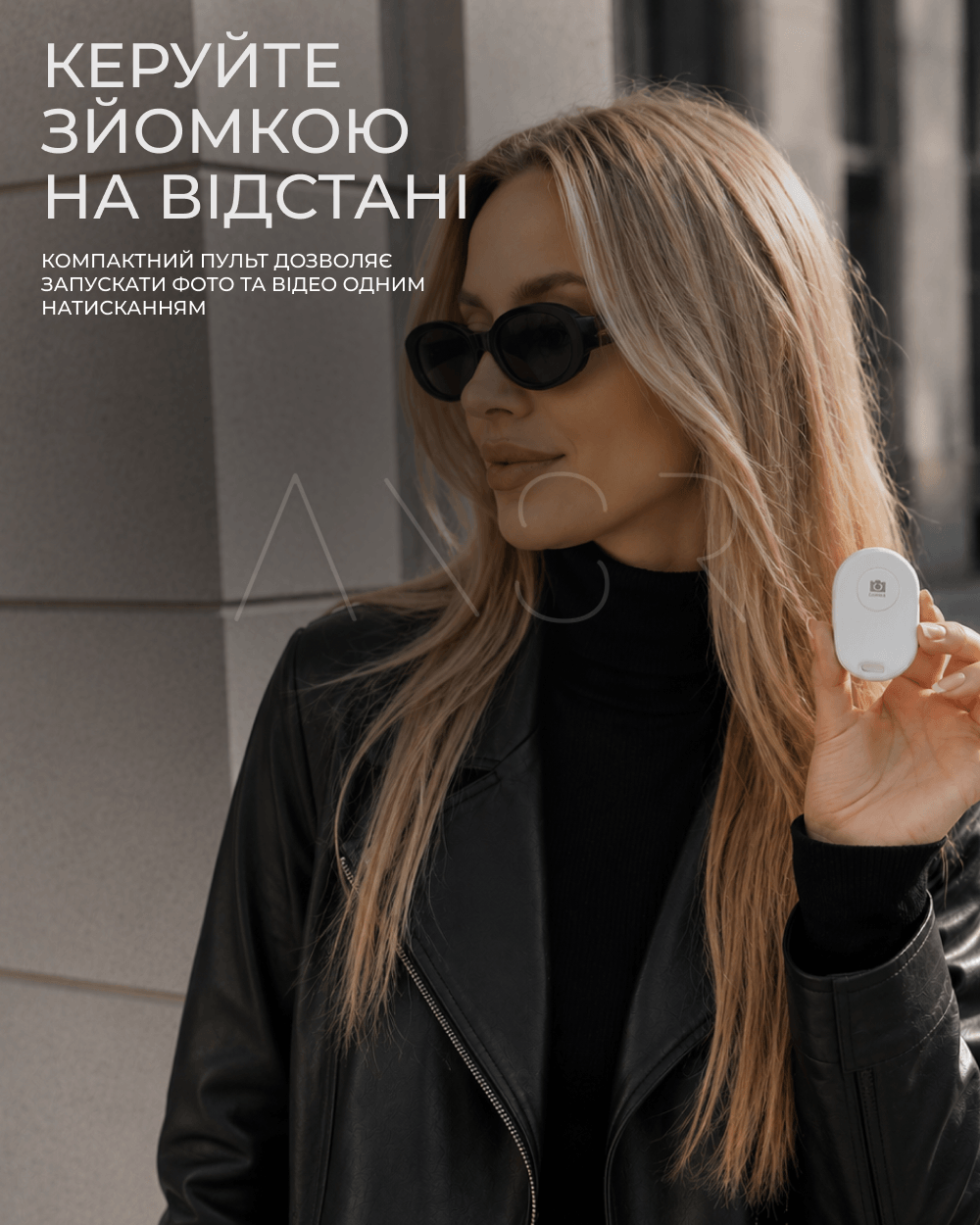 бездротовий пульт дистанційного затвора для монітора X40 в руці